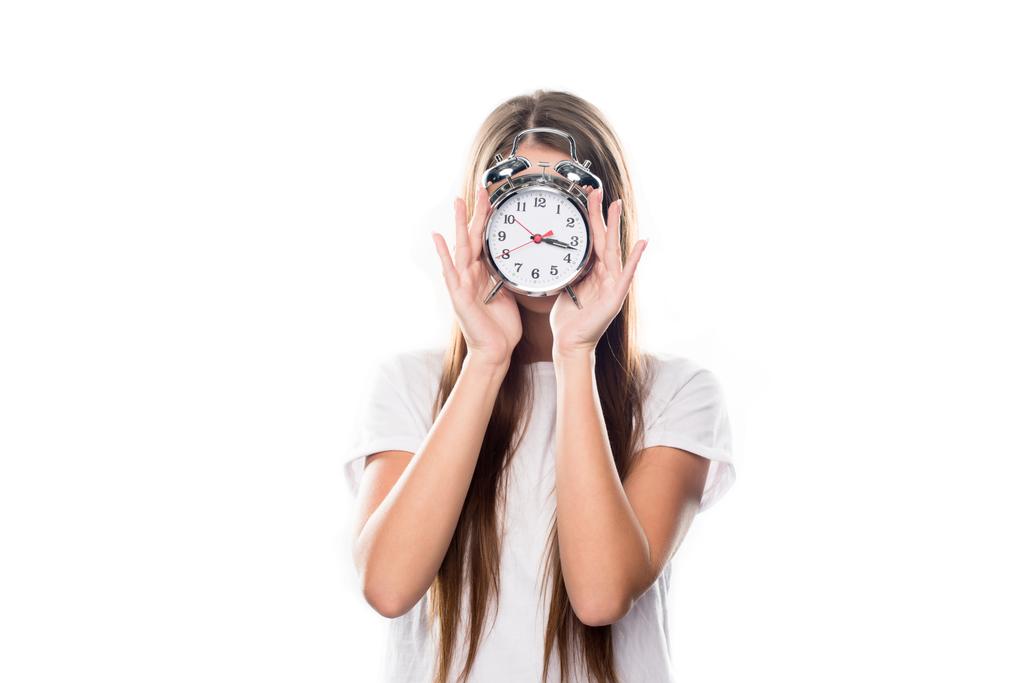 Girl covering face with alarm clock - Photo, Image