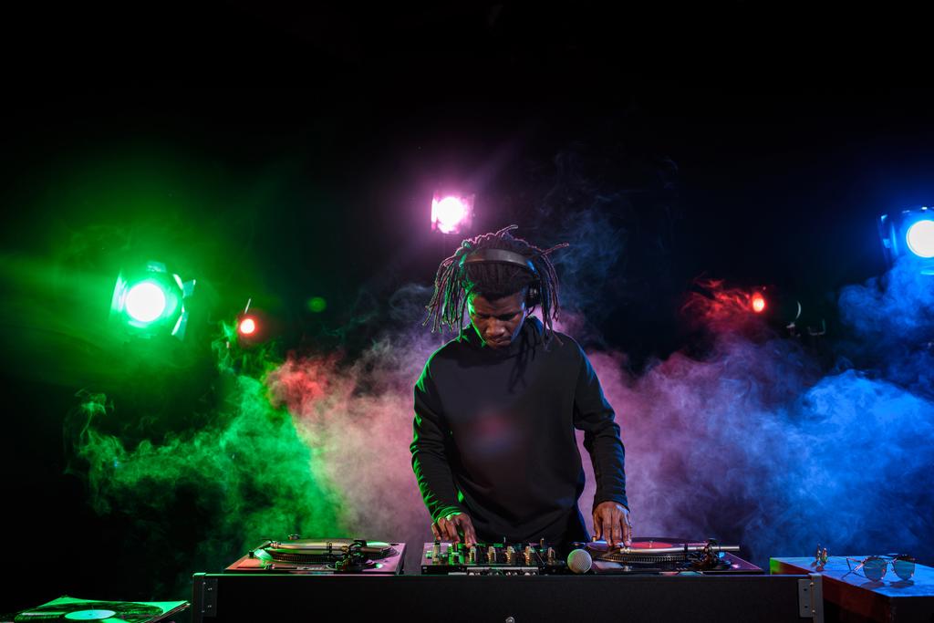 DJ in headphones with sound mixer - Photo, Image