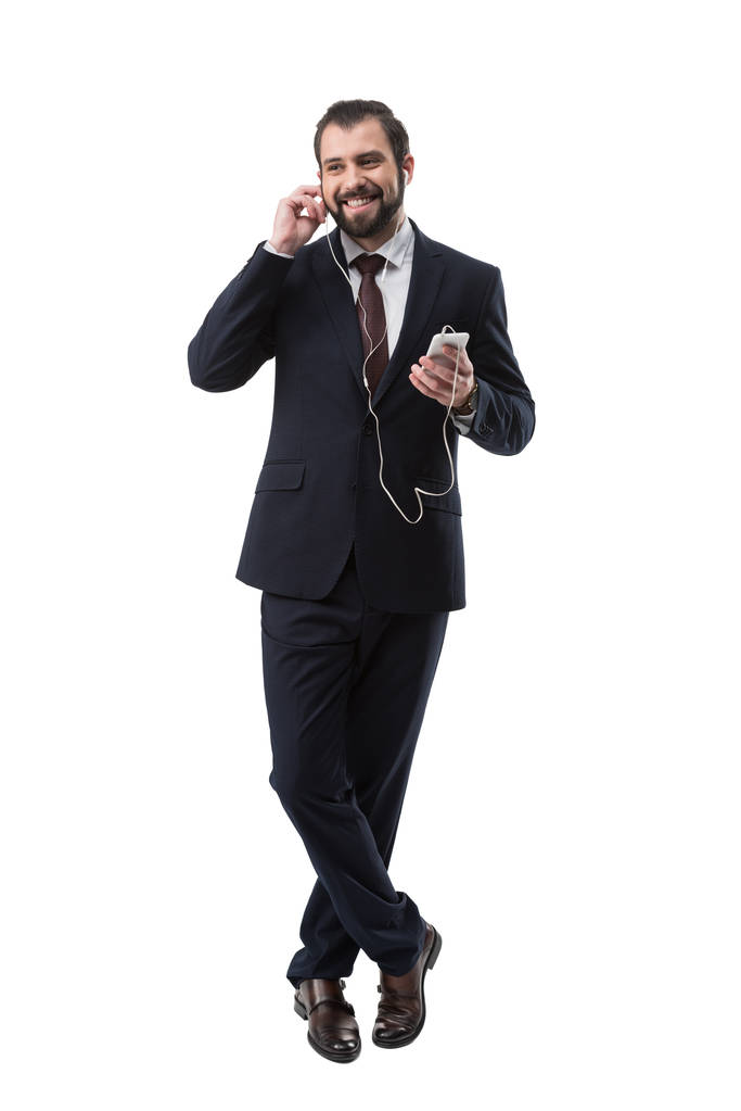 smiling businessman listening music - Photo, Image