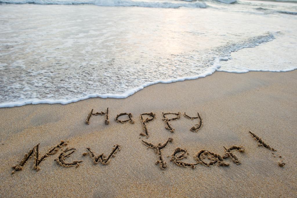 feliz año nuevo signo en la playa
 - Foto, Imagen