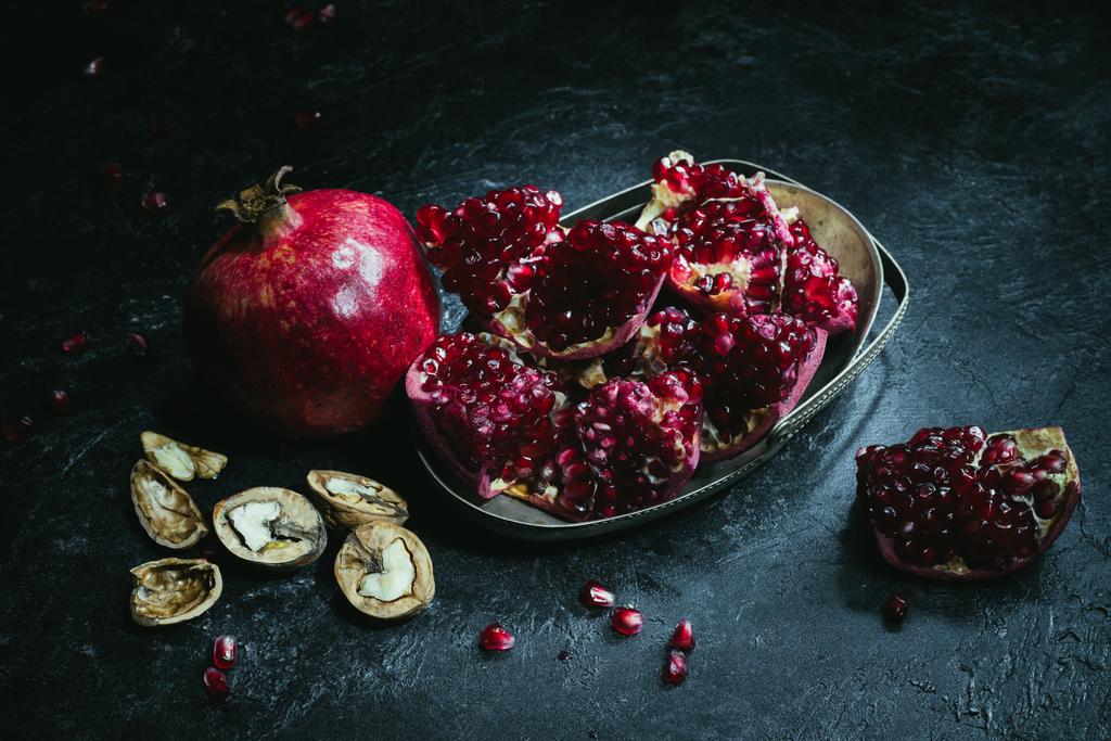 pomegranates in metal bowl - Photo, Image