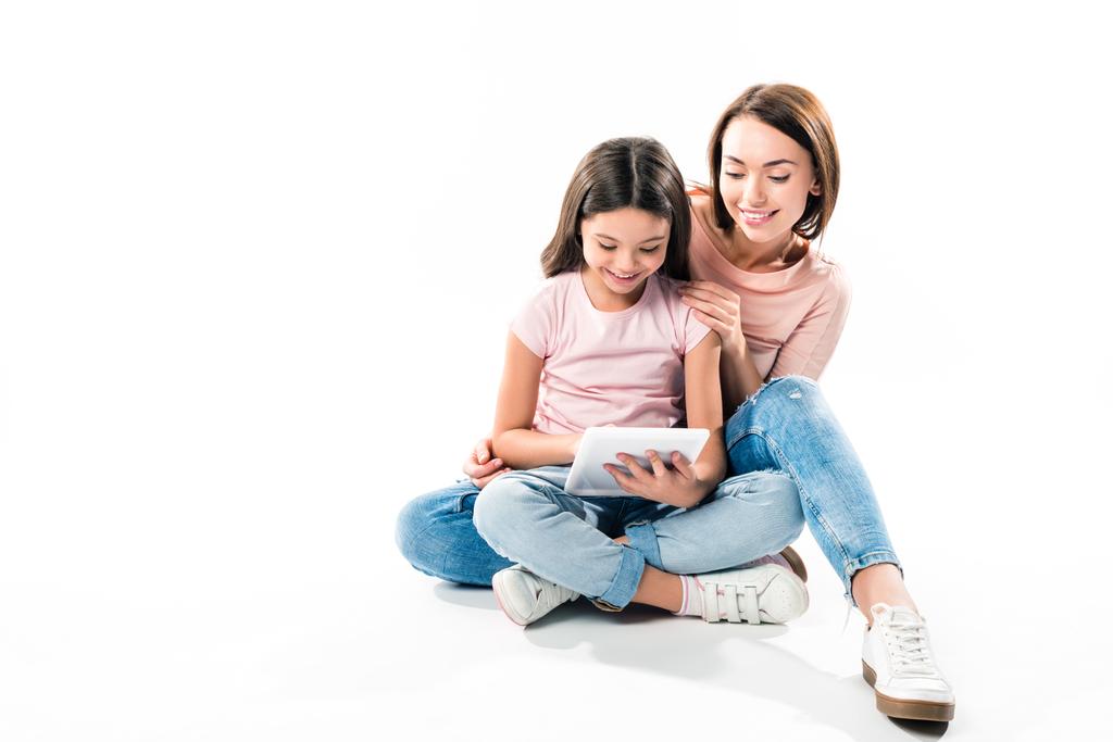 Mother and daughter looking at tablet - Photo, Image