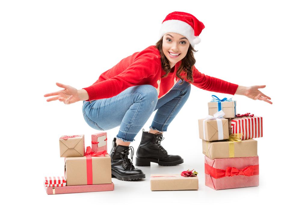 mulher no chão com presentes de Natal
  - Foto, Imagem