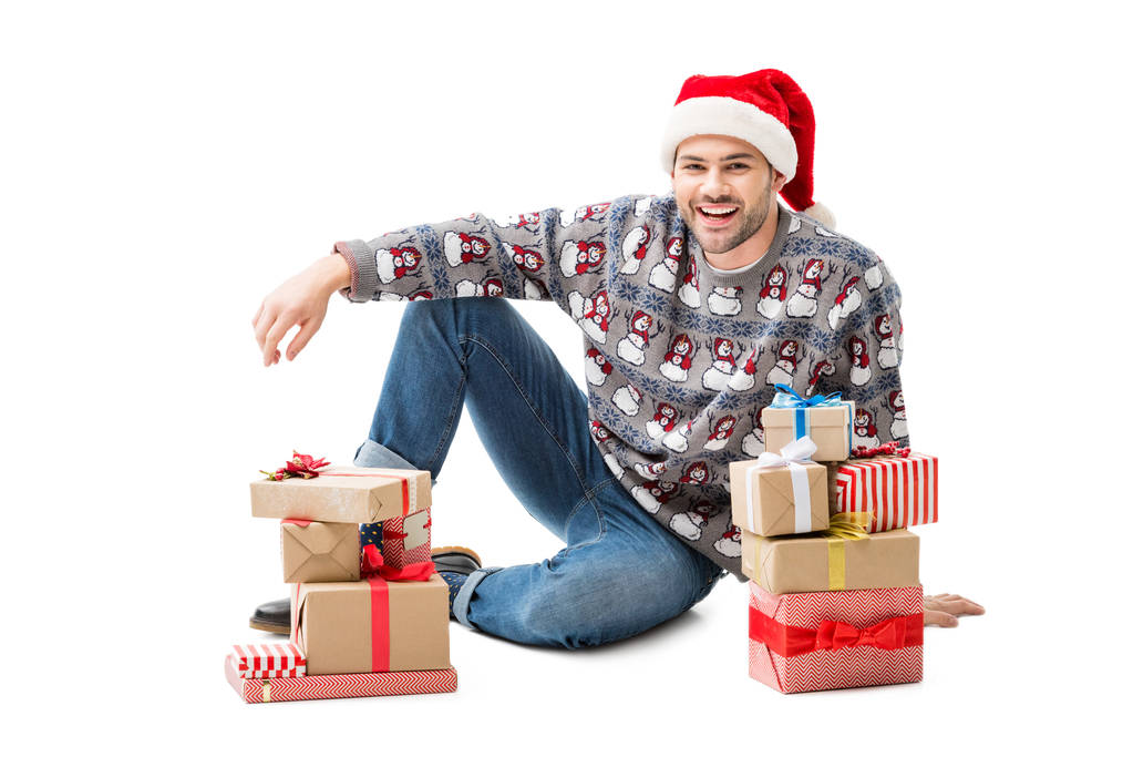 hombre sentado en el suelo con regalos de Navidad
 - Foto, Imagen