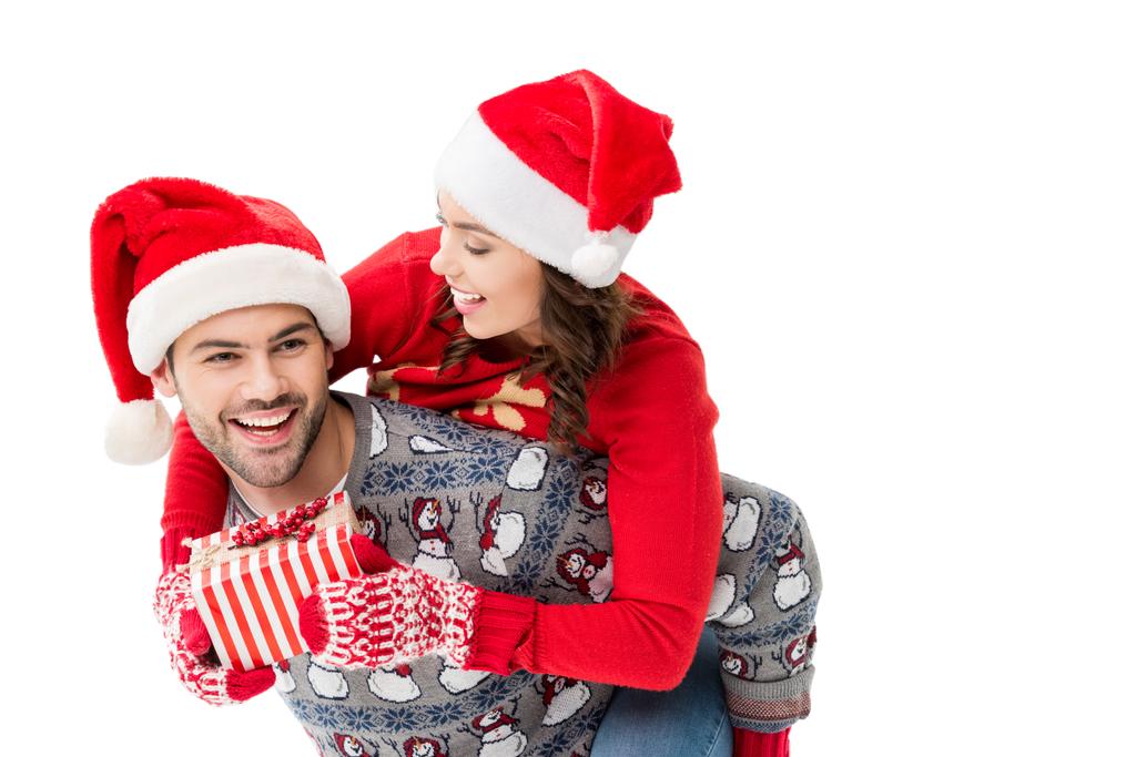 young couple in santa hats - Photo, Image