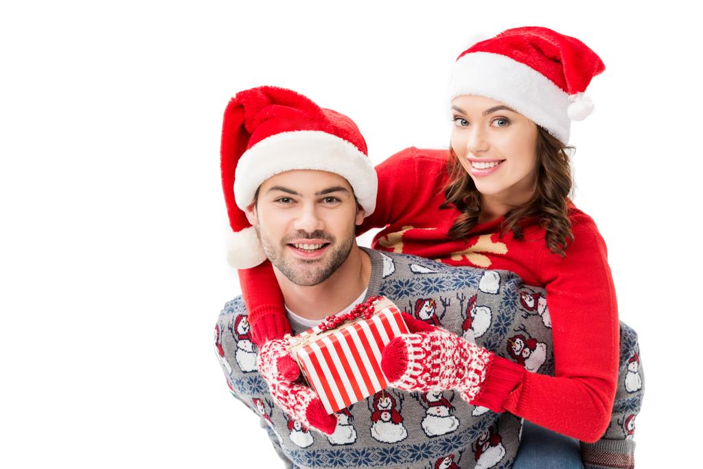 young couple in santa hats - Photo, Image