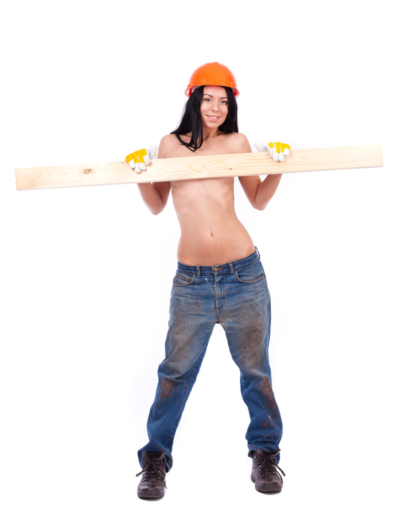 Топлес дівчина в робочому одязі в помаранчевому шоломі
 - Фото, зображення