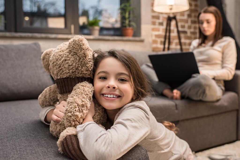 kid playing with teddy bear - Photo, Image
