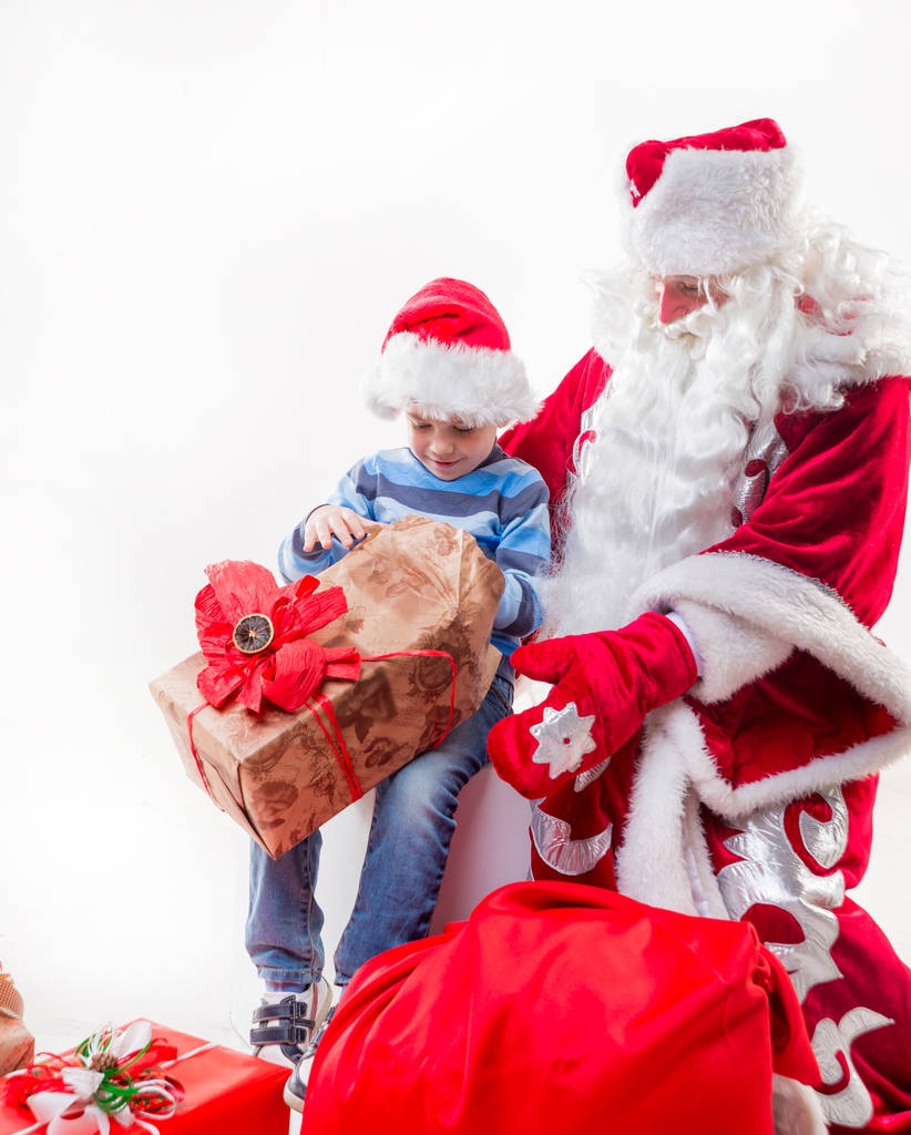 Санта-Клауса з маленьким хлопчиком - Фото, зображення