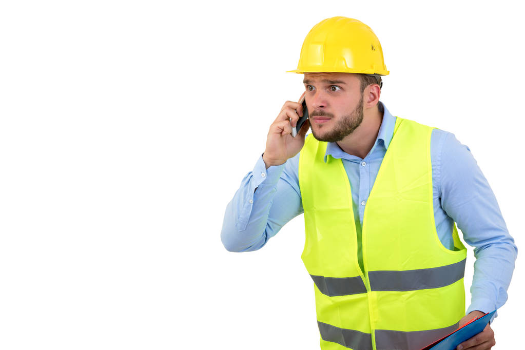 Irritado chateado jovem engenheiro de construção yeling no telefone
 - Foto, Imagem