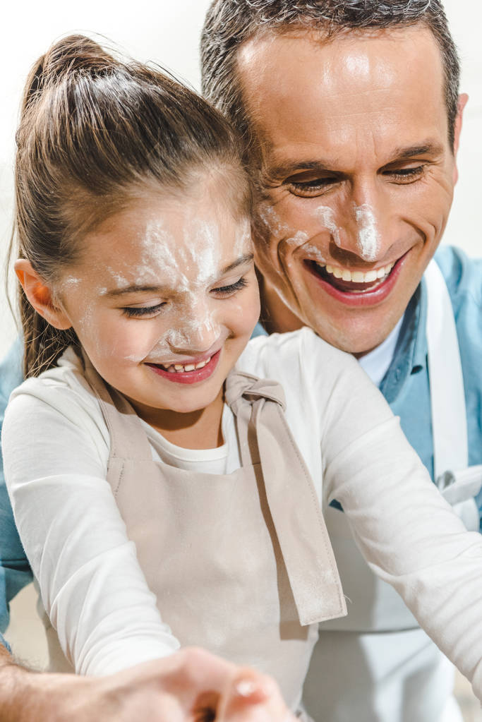 father and daughter with faces in flour - Photo, Image