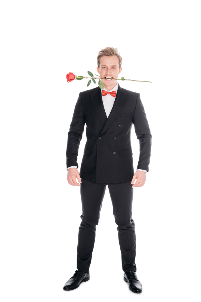 stijlvolle man met roos in tanden - Foto, afbeelding