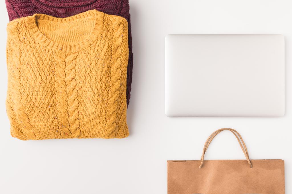 sweaters, laptop and shopping bag - Photo, Image