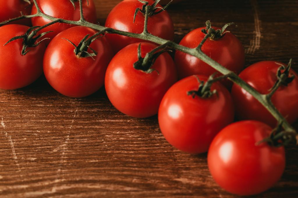close up of Cherry tomatoes on wooden tabletop - Photo, Image