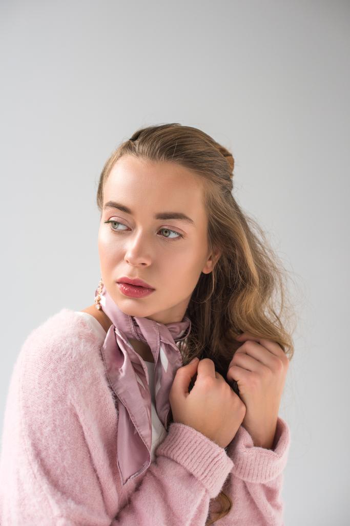 attractive woman in pink shirt and scarf looking away isolated on gray - Photo, Image