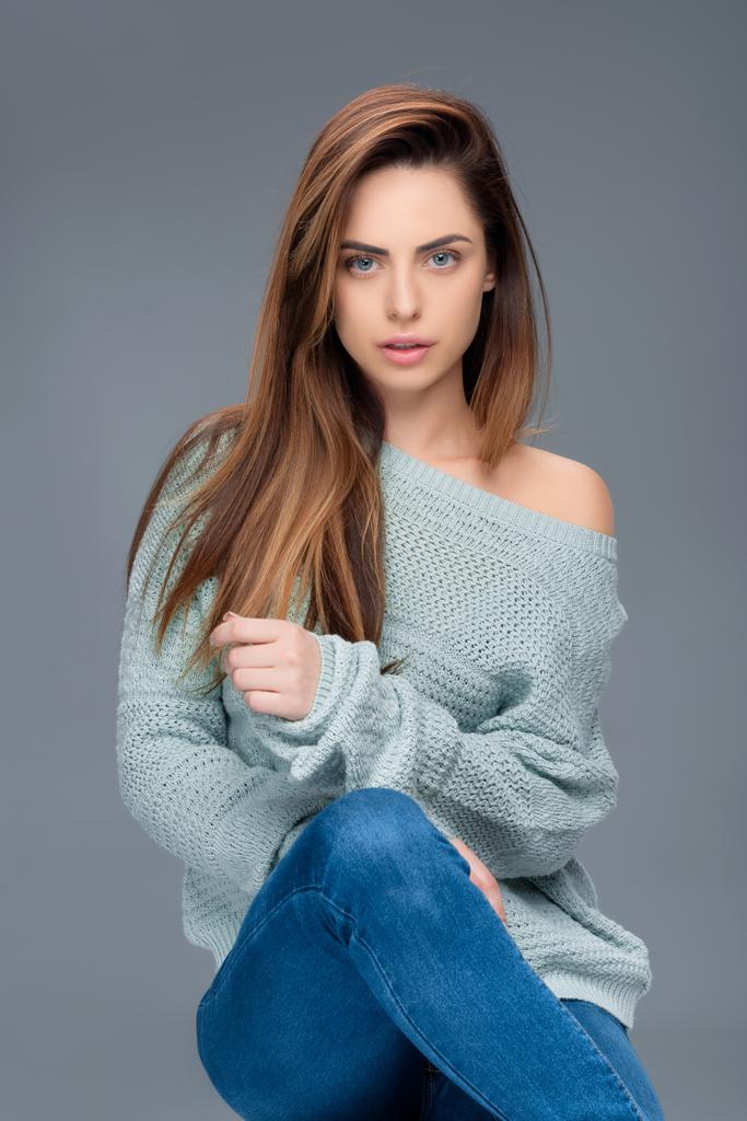 beautiful stylish girl posing in sweater, isolated on grey - Photo, Image