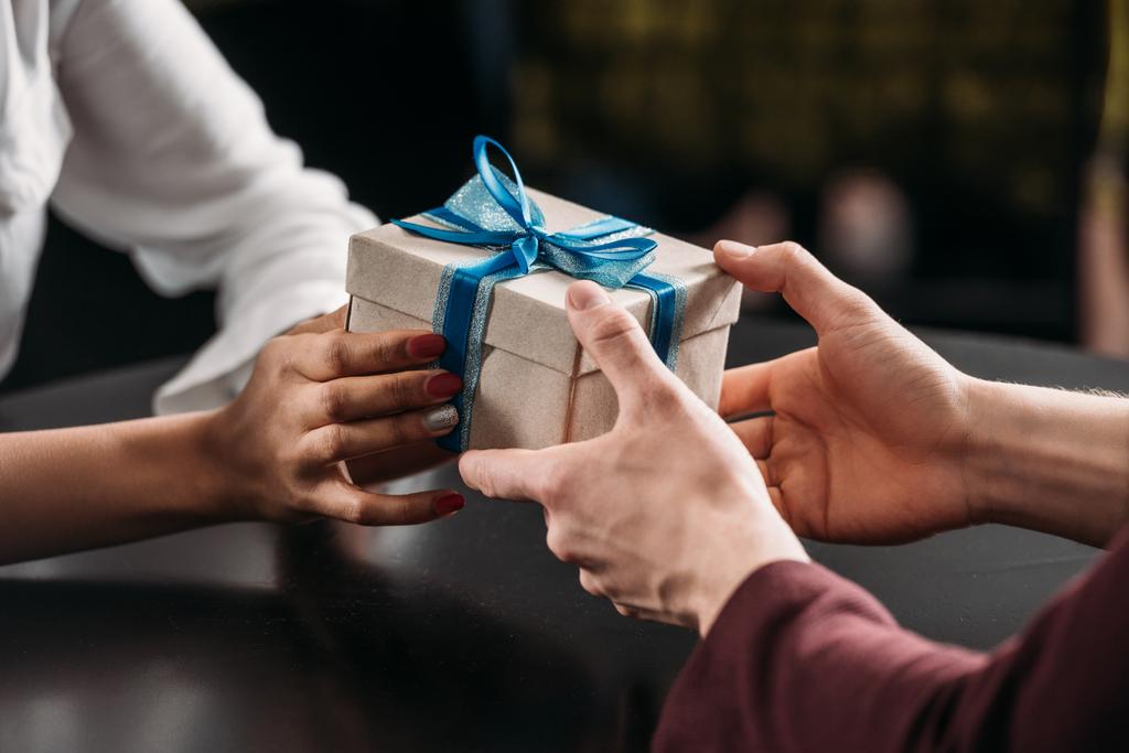 cropped shot of man giving anniversary gift to girlfriend - Photo, Image