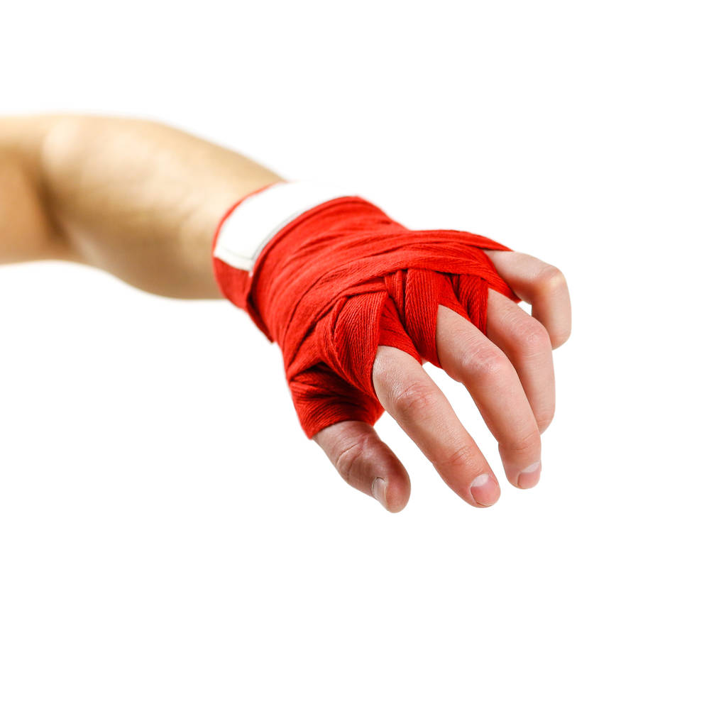 Hand in red Boxing bandages. Sports armband. Isolated on white b - Photo, Image