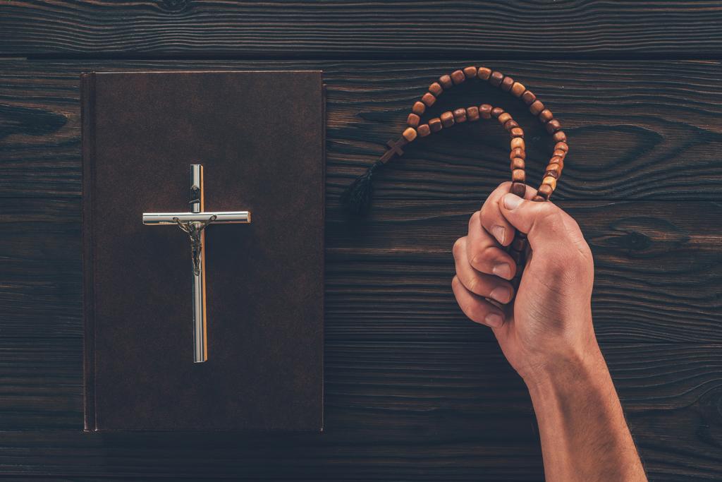 cropped image of man holding rosary in hand - Photo, Image