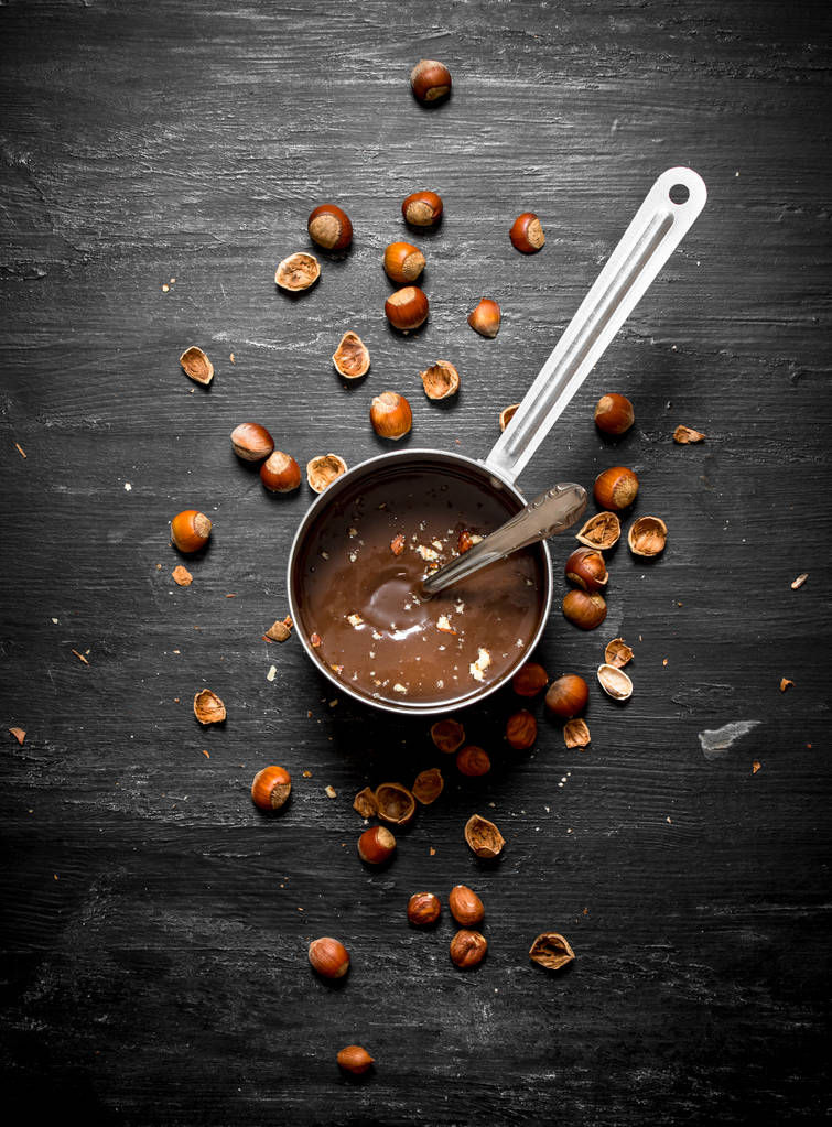 Chocolate butter with hazelnuts in a pan. - Photo, Image