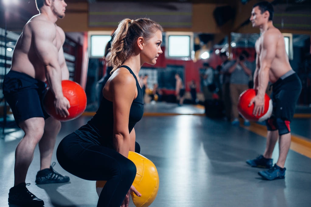Cross fit woman with ball in gym - Photo, Image