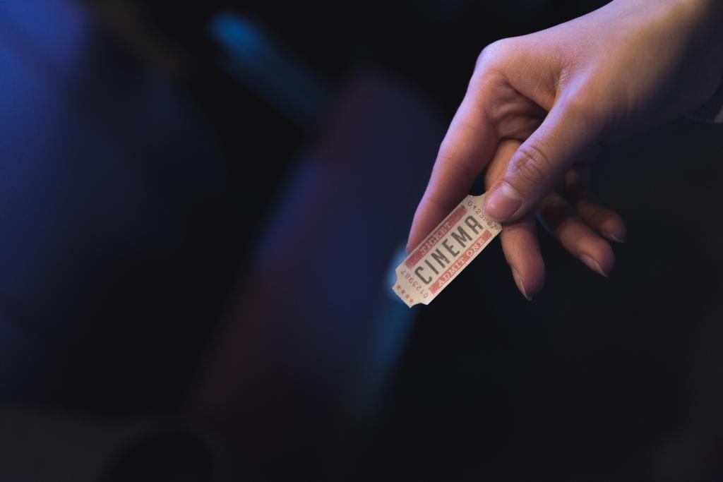 cropped view of woman holding cinema ticket in hand - Photo, Image