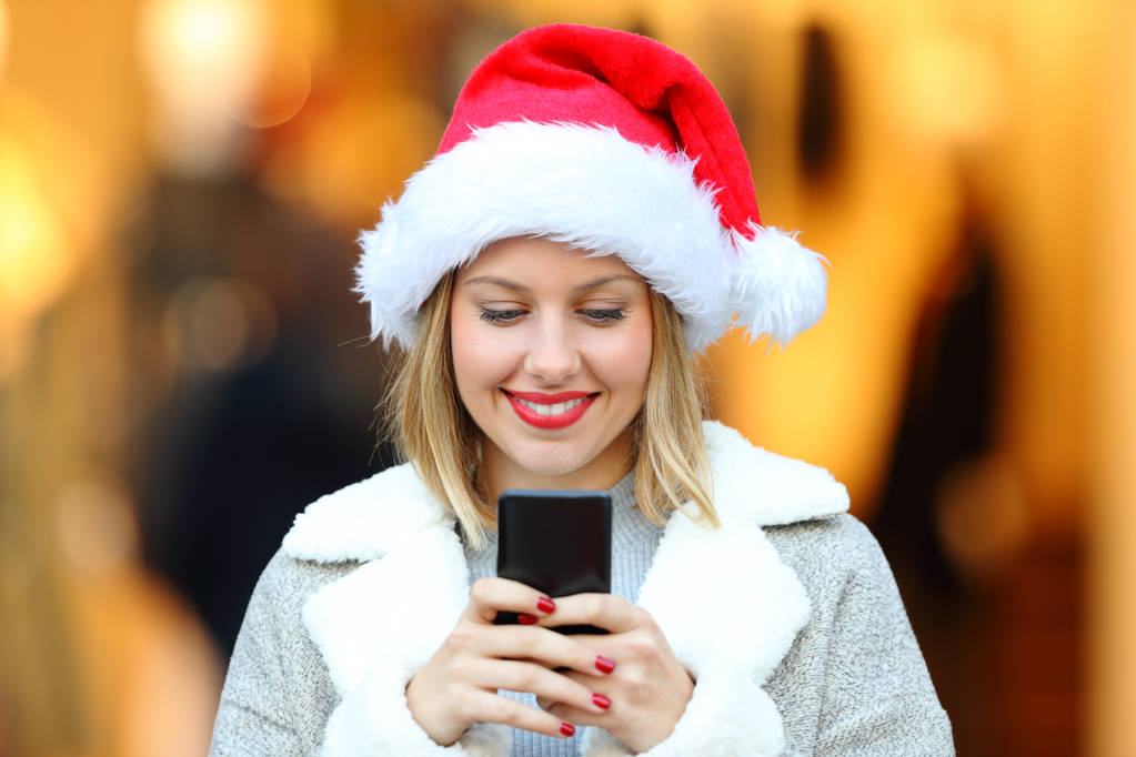 Kız Noel tatili telefon mesajları gönderme - Fotoğraf, Görsel