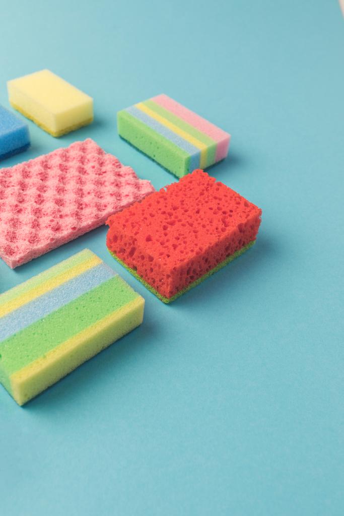 studio shot of different washing kitchen sponges, on blue - Photo, Image