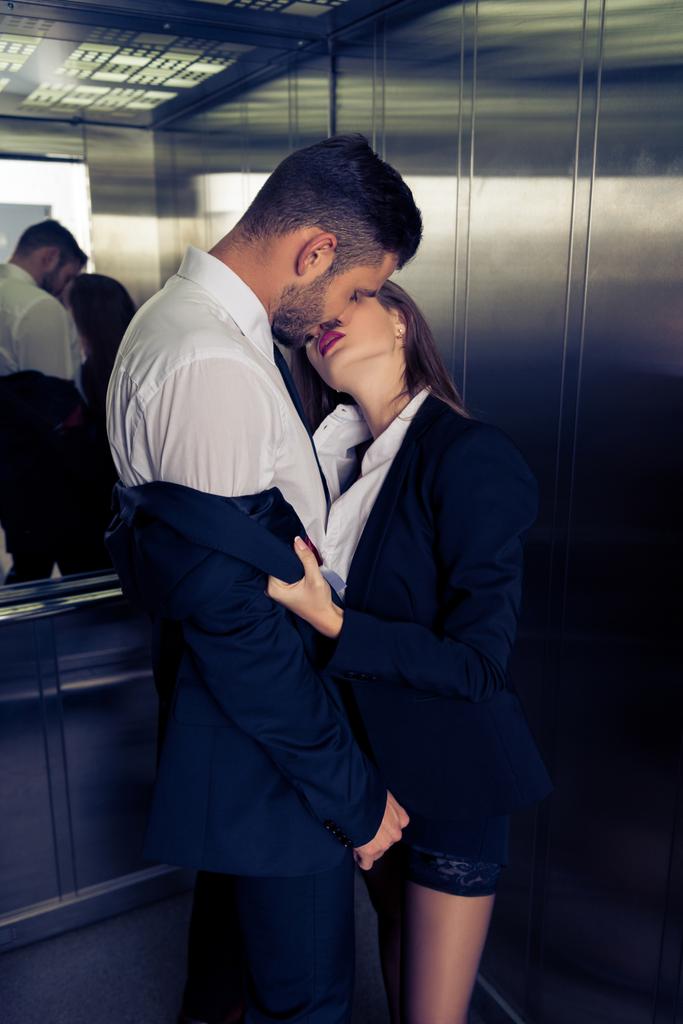 sensual business couple undressing in elevator - Photo, Image