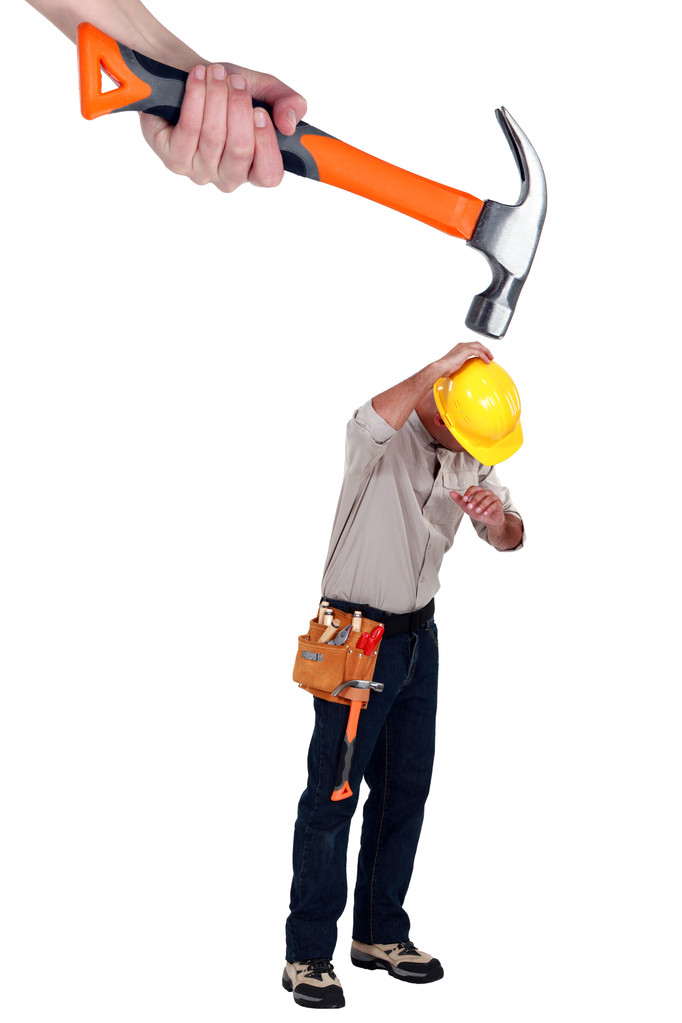 Constructor siendo atacado por un martillo gigante
 - Foto, Imagen