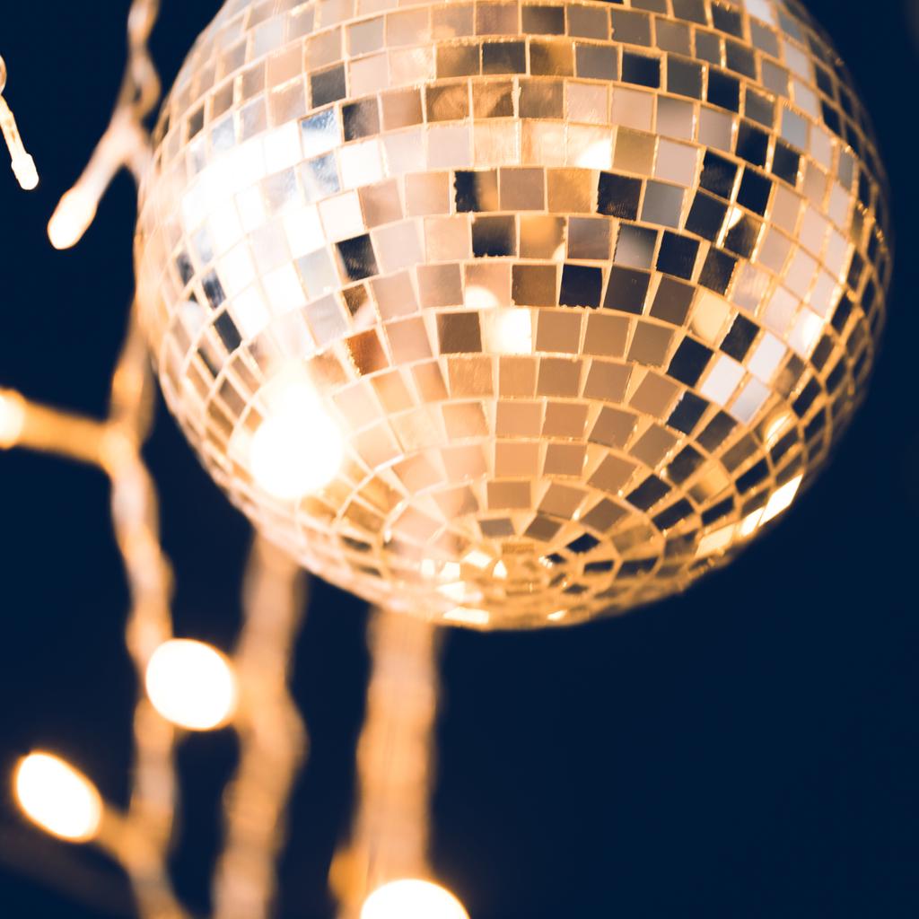 close-up shot of glossy disco ball with garland - Photo, Image