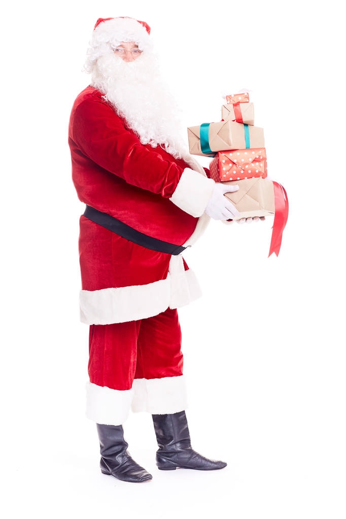 Weihnachtsmann mit vielen Geschenken - Foto, Bild