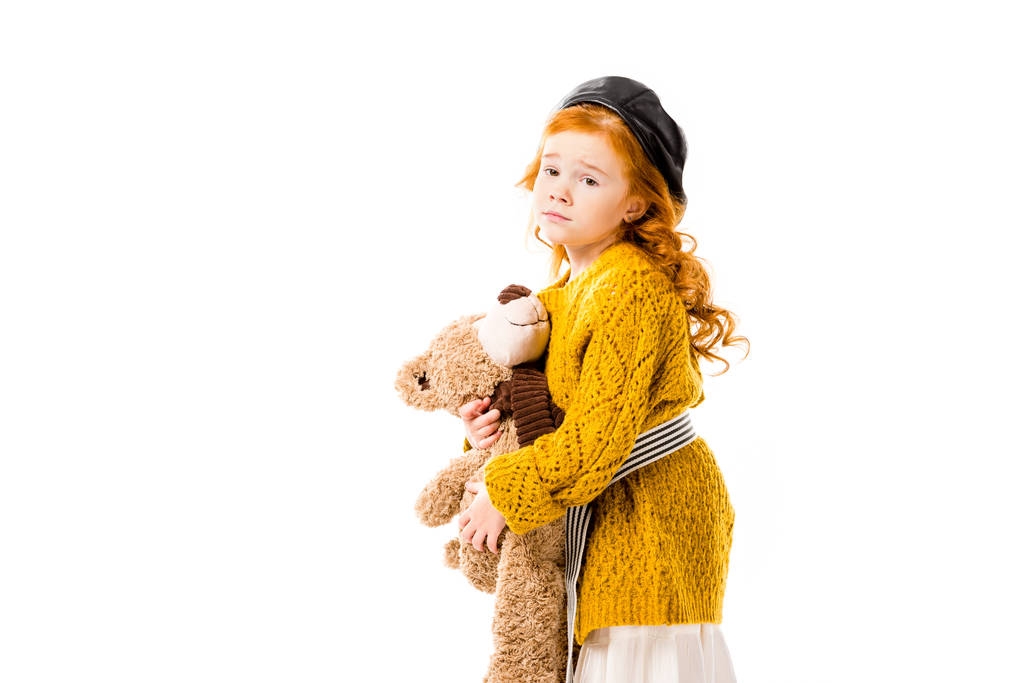 upset red hair kid hugging teddy bear isolated on white - Photo, Image