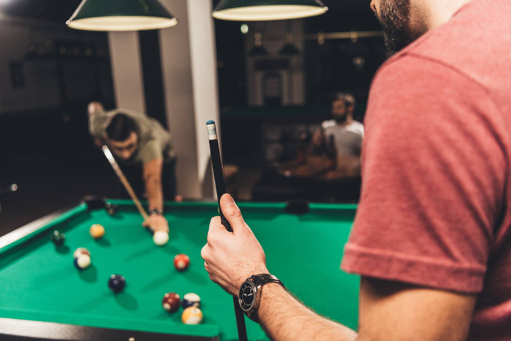caucasian man beside billiard table at bar with friends  - Photo, Image