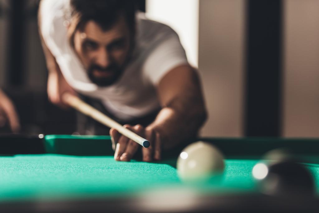 handsome caucasian man playing in pool  - Photo, Image