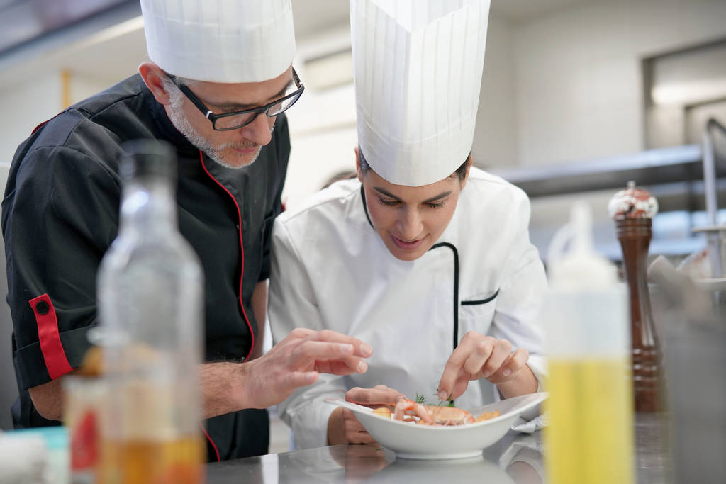 Professional cook chefs in kitchen improving dish composition - Photo, Image