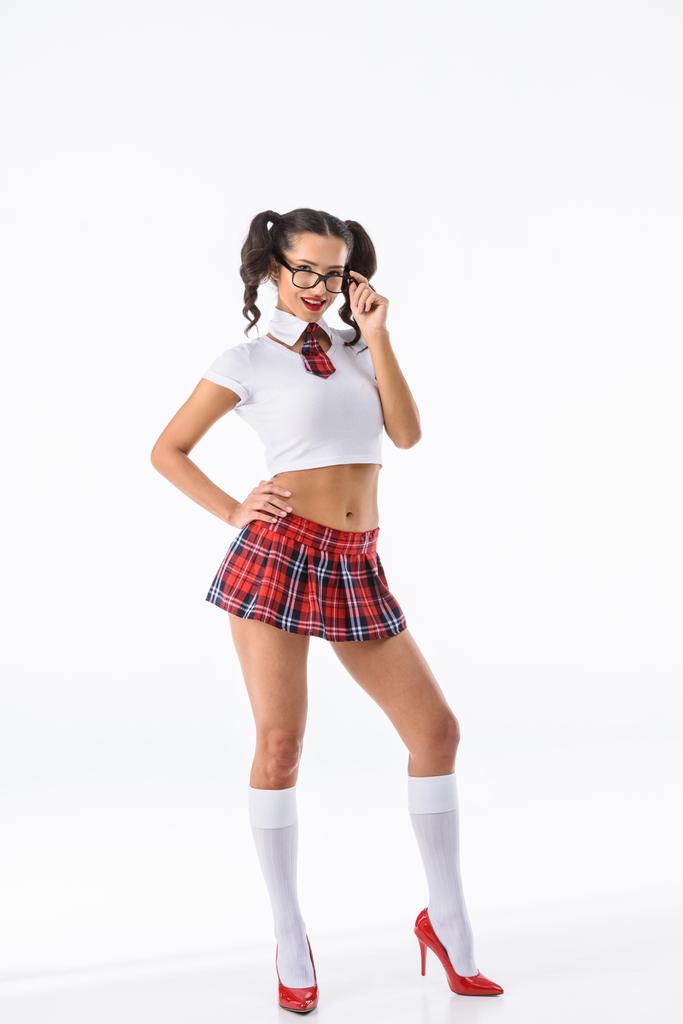 mladá sexy školačka v červené kostkované sukně a brýle izolované na bílém - Fotografie, Obrázek