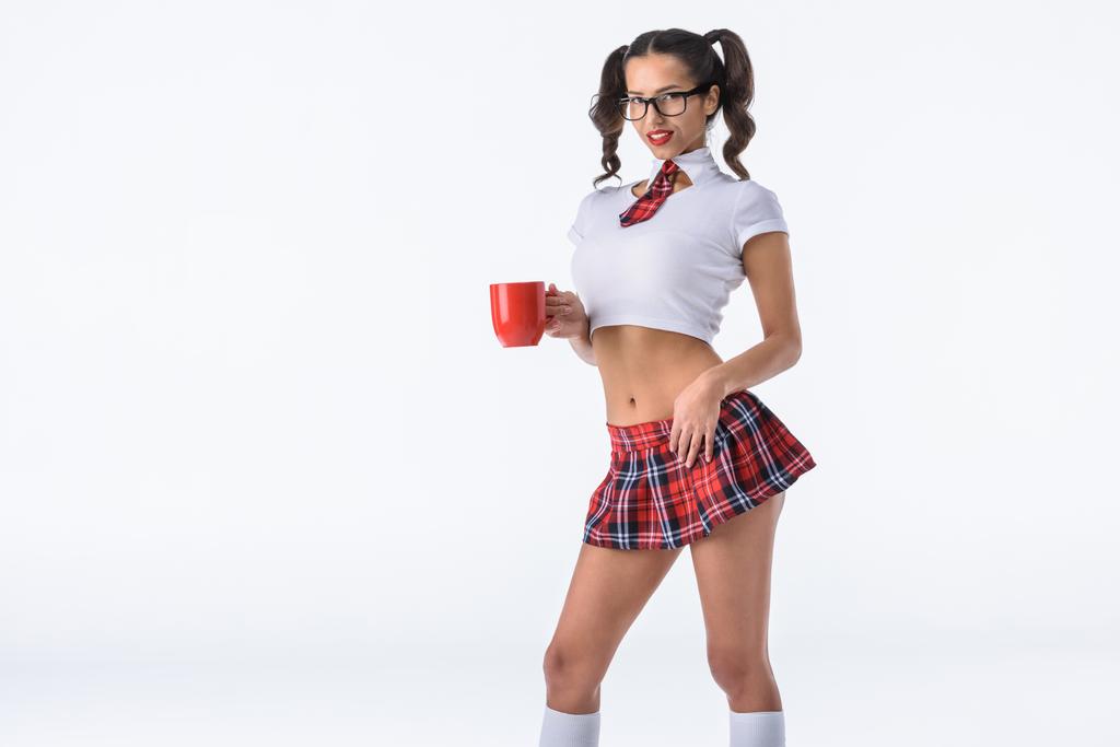 Happy sexy školačka s šálkem kávy izolované na bílém - Fotografie, Obrázek