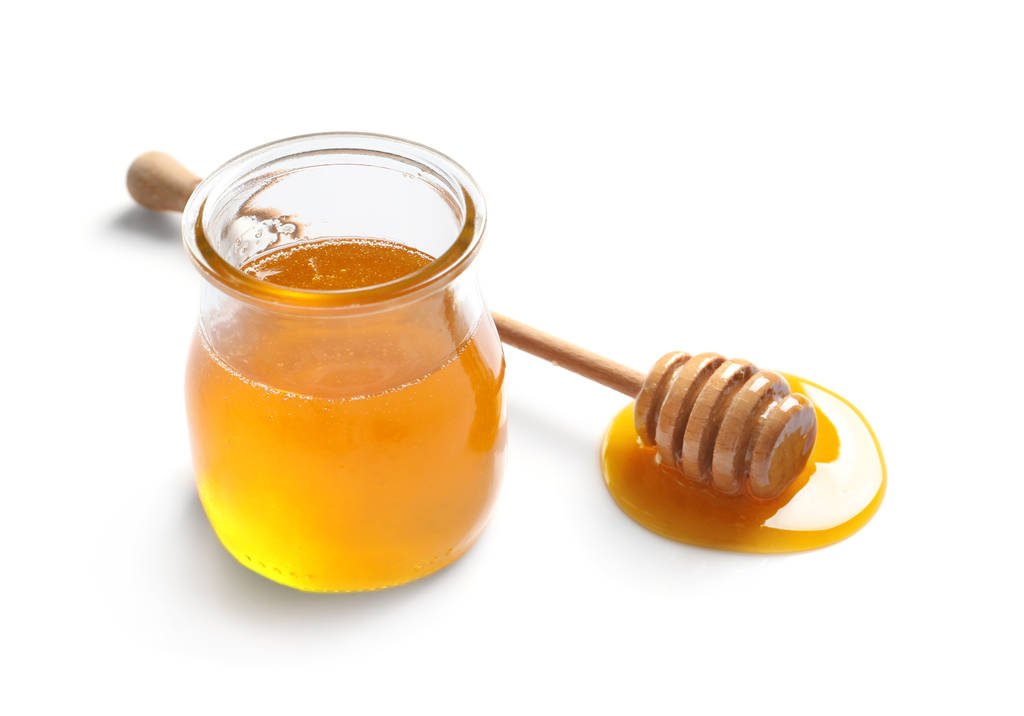 Γυάλινο βάζο με μέλι και κουτάλα - Φωτογραφία, εικόνα
