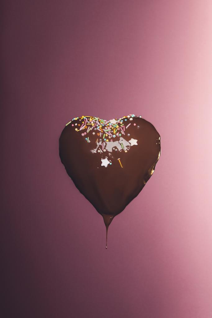 chocolate heart shaped candy with glaze isolated on pink - Photo, Image