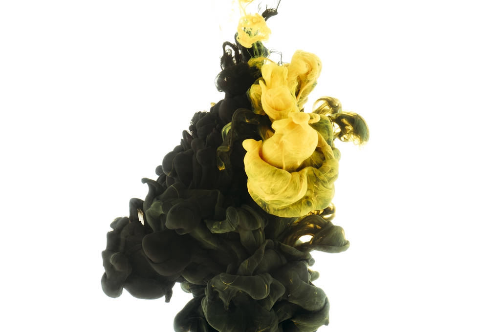 mezcla de salpicaduras de pintura negra y amarilla, aisladas sobre blanco
 - Foto, imagen