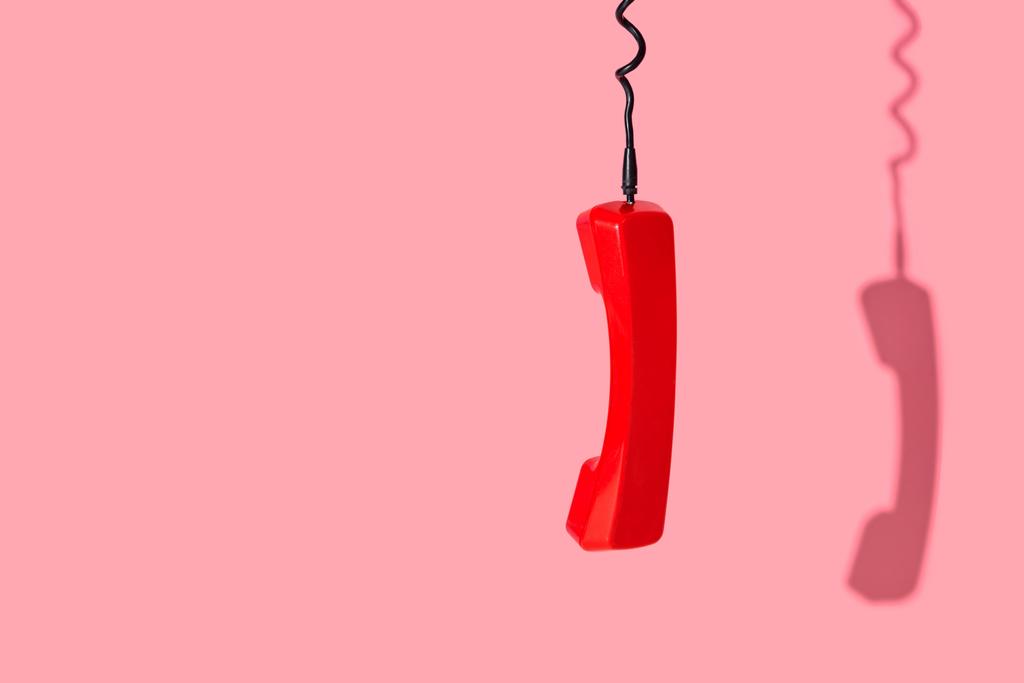 View of old telephone handset on pink background - Photo, Image