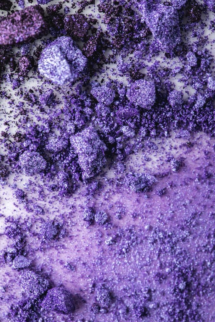 top view of spilled purple cosmetic eye shadows - Photo, Image
