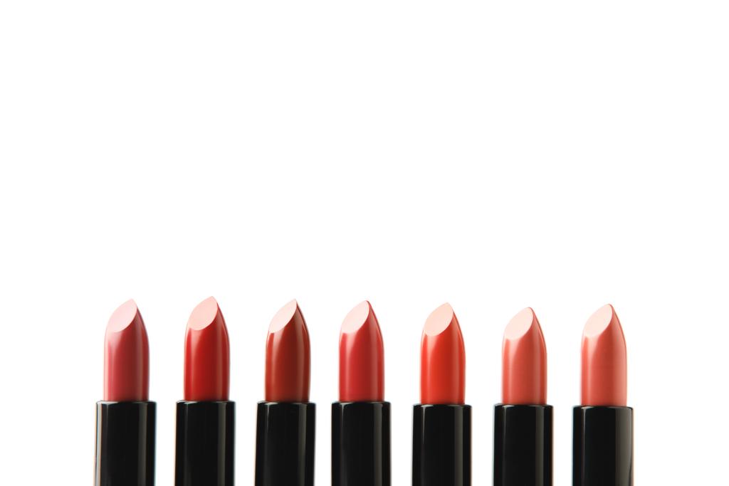 row of lipsticks of various shades isolated on white - Photo, Image