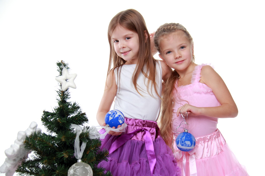 Two girls decorating Christmas tree - Photo, Image