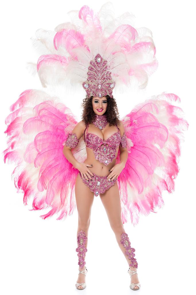 ピンクの羽は、白で隔離、カーニバルの衣装でポーズをとって魅惑的な女の子 - 写真・画像