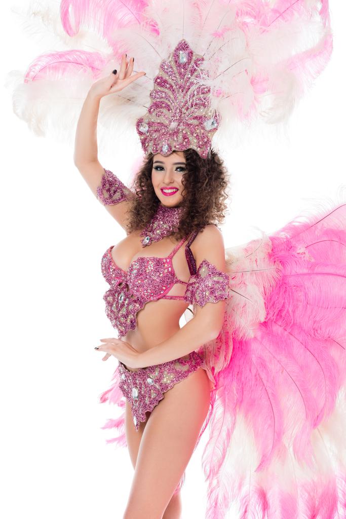 ピンクの羽は、白で隔離、カーニバルの衣装でポーズをとって幸せな女の子 - 写真・画像