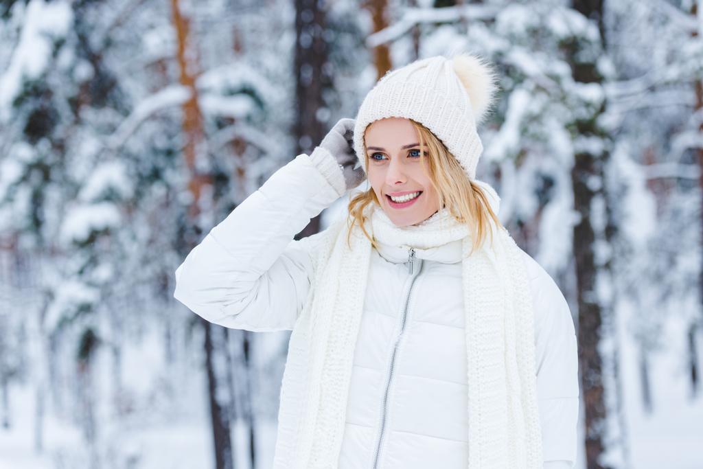 portrait of beautiful happy woman in snowy winter forest - Photo, Image