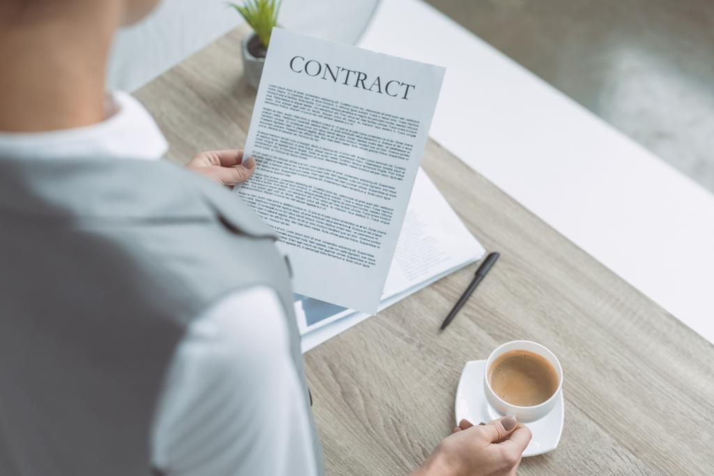cropped image of businesswoman reading contract - Photo, Image