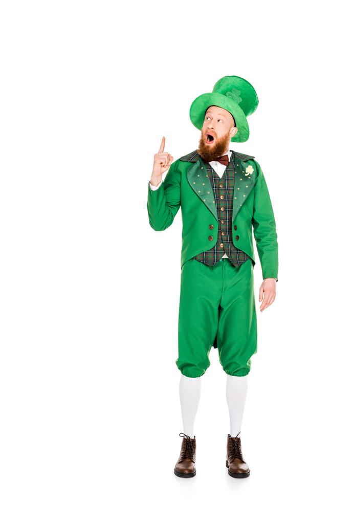 handsome leprechaun in green suit and hat pointing up, isolated on white - Photo, Image